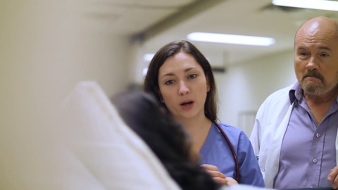 Healthcare professionals attending to patient